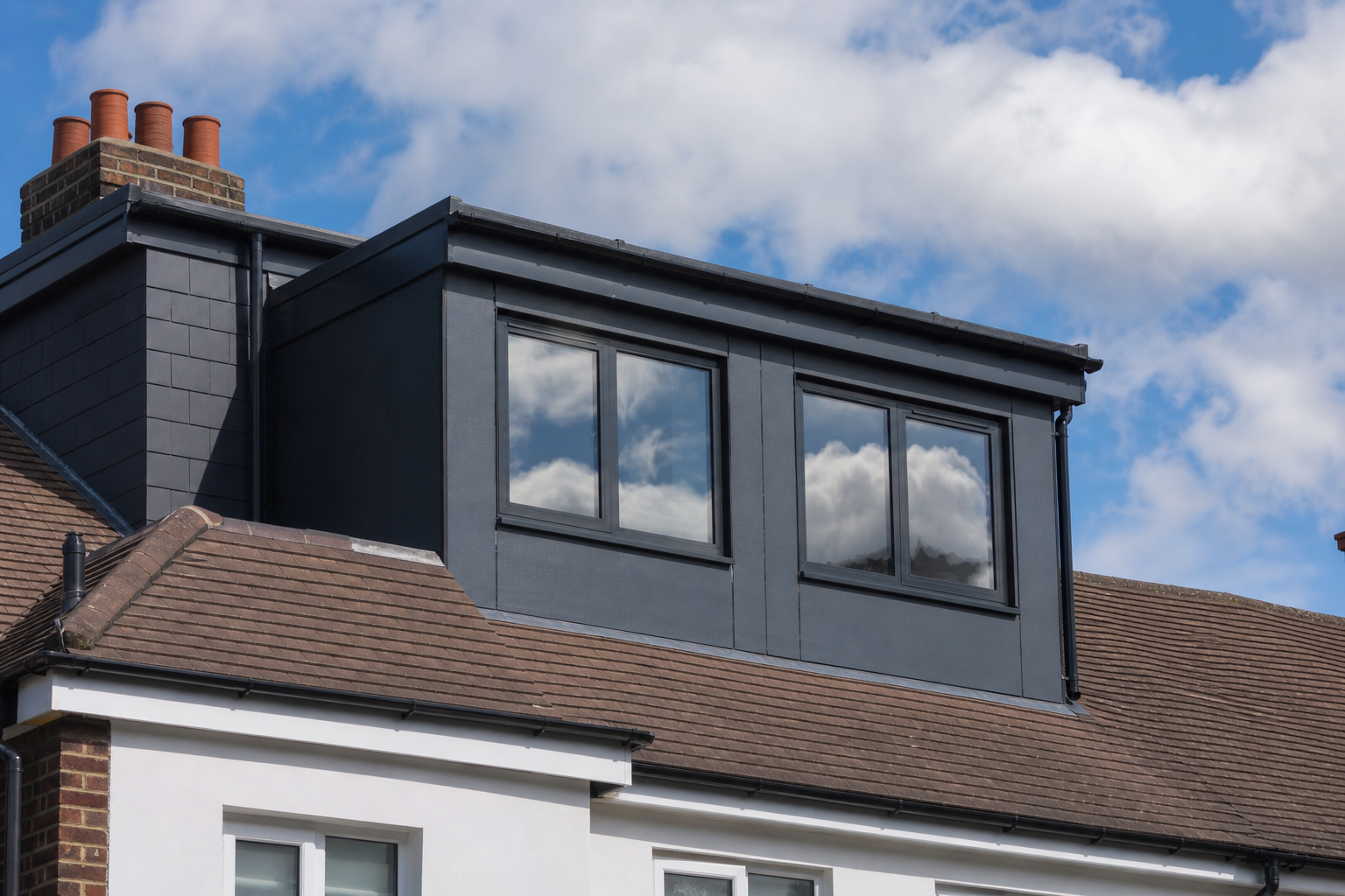 Rooflights and dormer windows flooding the loft bedroom with daylight
