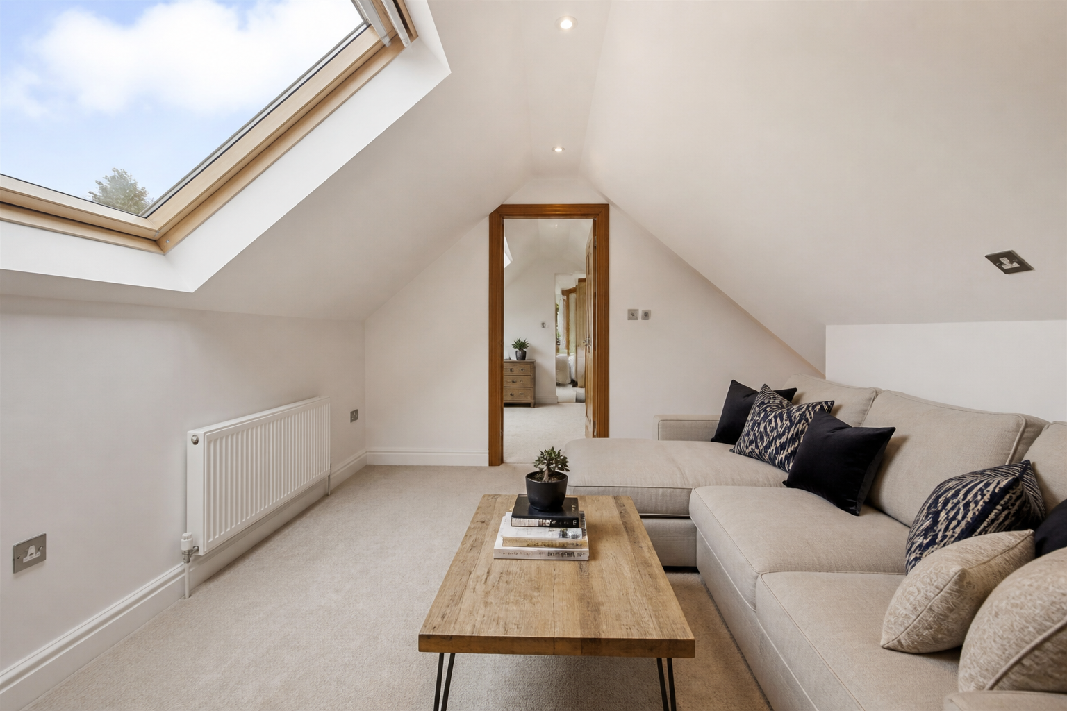 Interior view of the teenager's loft bedroom with rooflights above