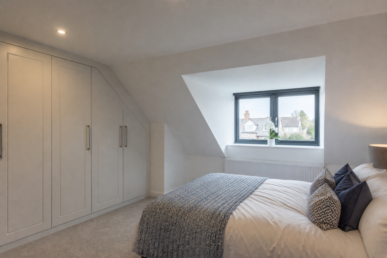 Interior view of the new master bedroom with rooflights above the bed