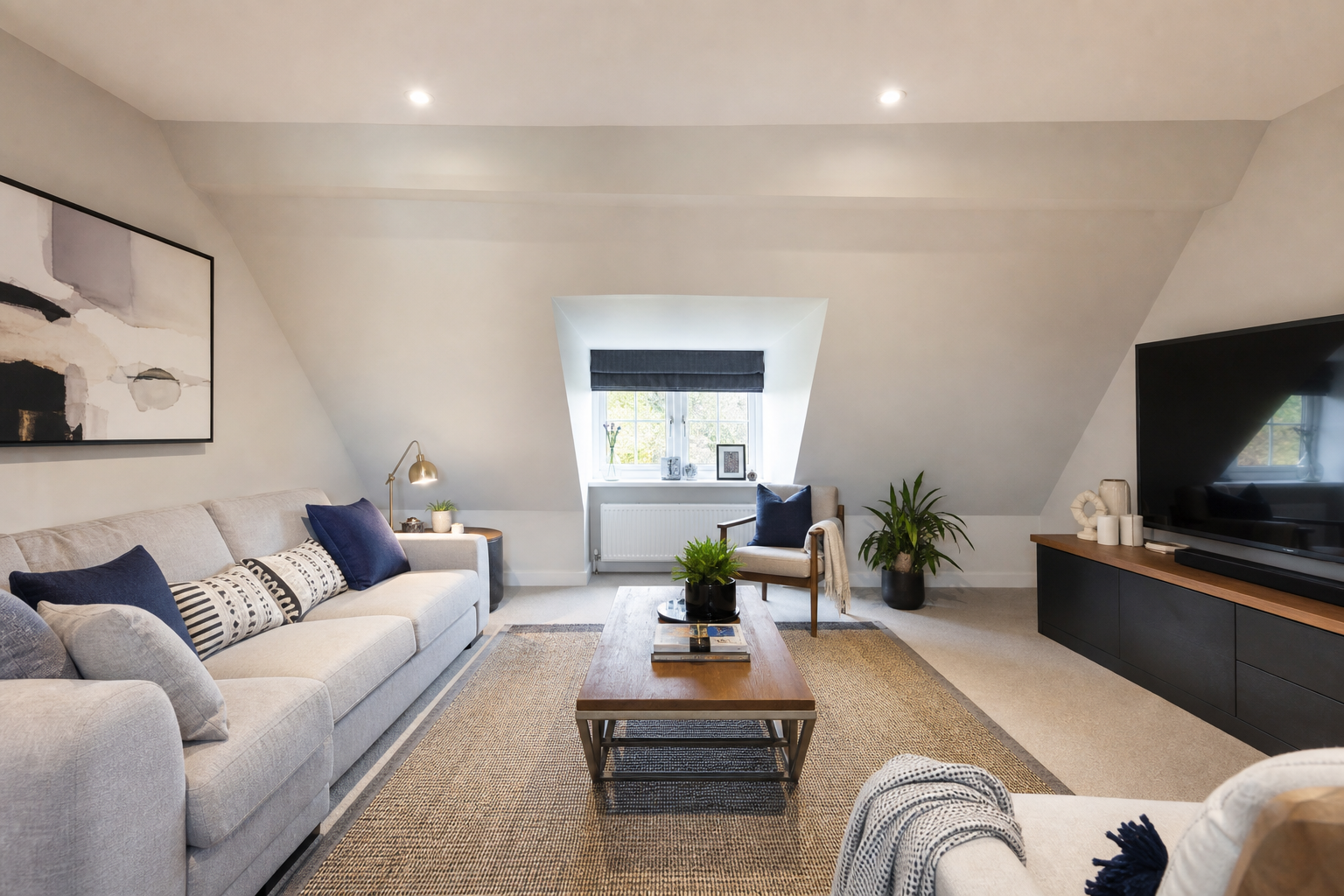 Interior view of the loft living space with sofa and built-in shelving